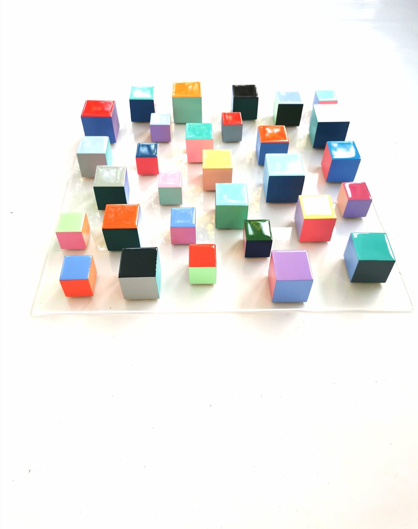 Geometric 3d wall art. Modern wall sculpture. Wood wall art with resin finish on top face. Happy and bold colors. Eye-catching colors. ©