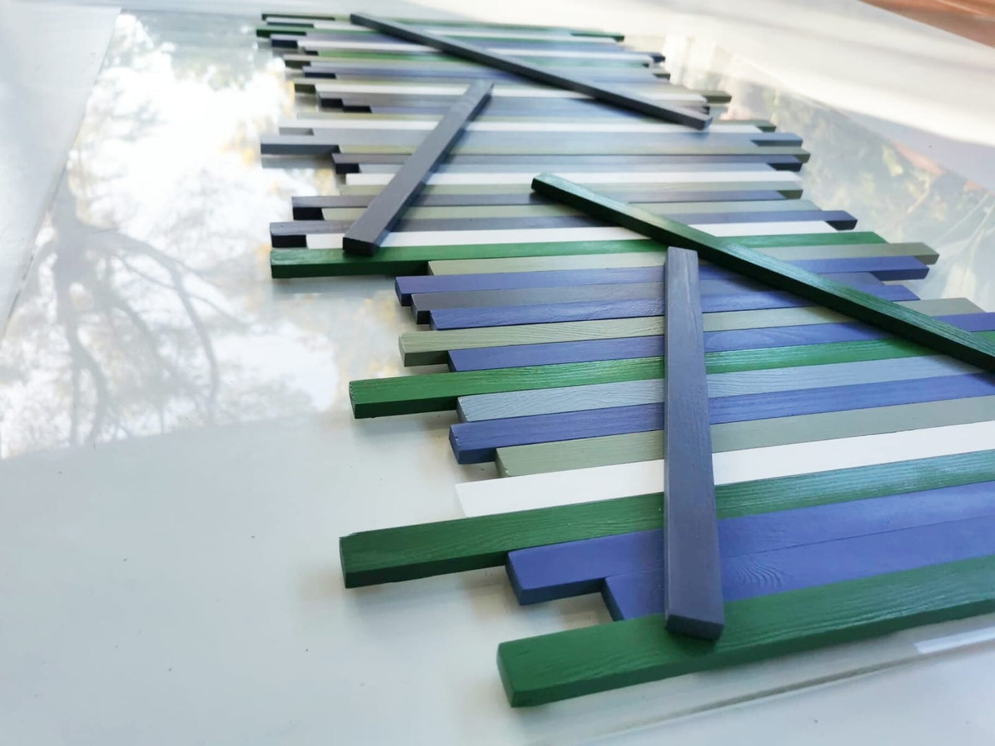 Long and Large wood wall art, sculpture and modern art. Made from hand-painted wooden slats, mounted on a transparent acrylic glass base ©