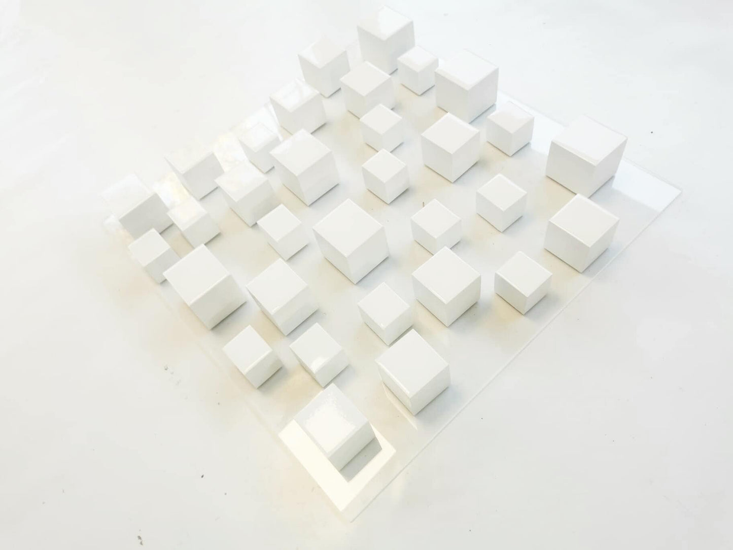 Wood wall art , modern and minimal design. Geometric 3 d wall art. White sculpture with resin finish on top face ©
