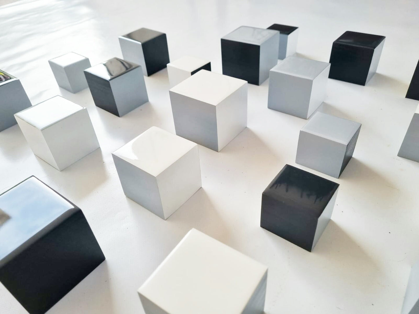 Choose the number of Self install wall art cubes. PACKS of hand painted black, white and grey wood cubes with shiny epoxy resin front face.©