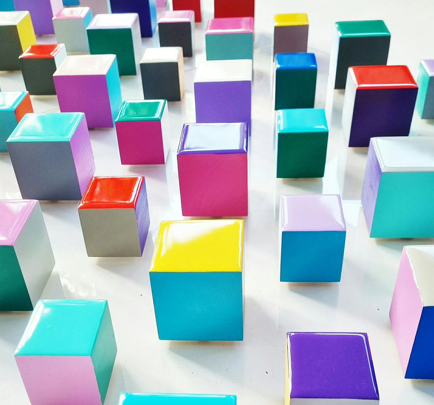 PACKS of hand painted colored wooden cubes with high quality, shiny epoxy resin front face. Choose the number of Self install wall art blocks ©