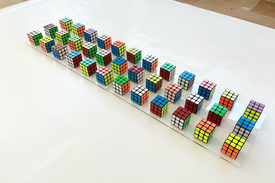 Original and unique Rubiks Cube wall art. 2 Rectangular bases 25" X 12.2" Magic cube puzzle wall piece ©. Perfect decoration for children