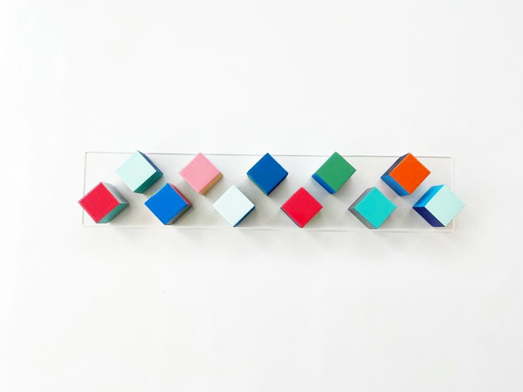 Wood art, geometric and modern wall art. Wood art cube sculpture with resin finish on the top face. Rainbow wall art, long and narrow art.