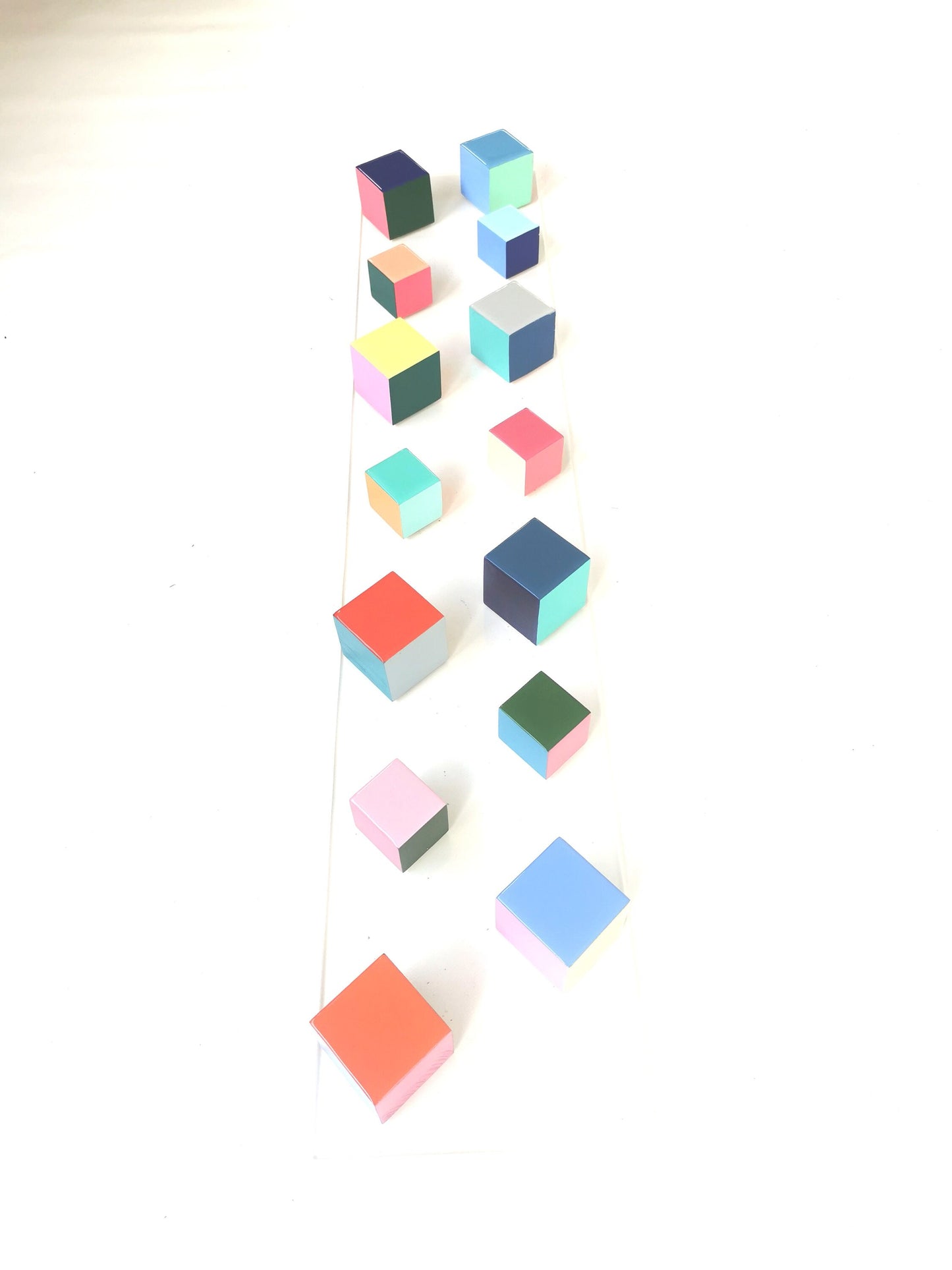 Narrow and long wood wall art. Geometric and colorful wood cubes. Happy colors. Modern 3D art. Wooden wall art with resin on the top face ©