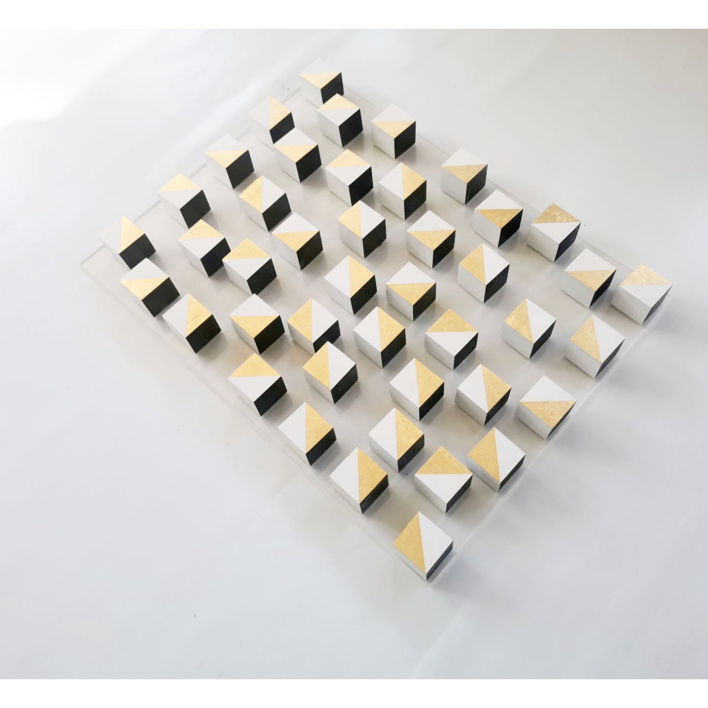 White and gold wood wall art. 3D art. Modern and geometric wall decor. Gold leaf, Home decoration and 3d installation. Sculpture wooden art