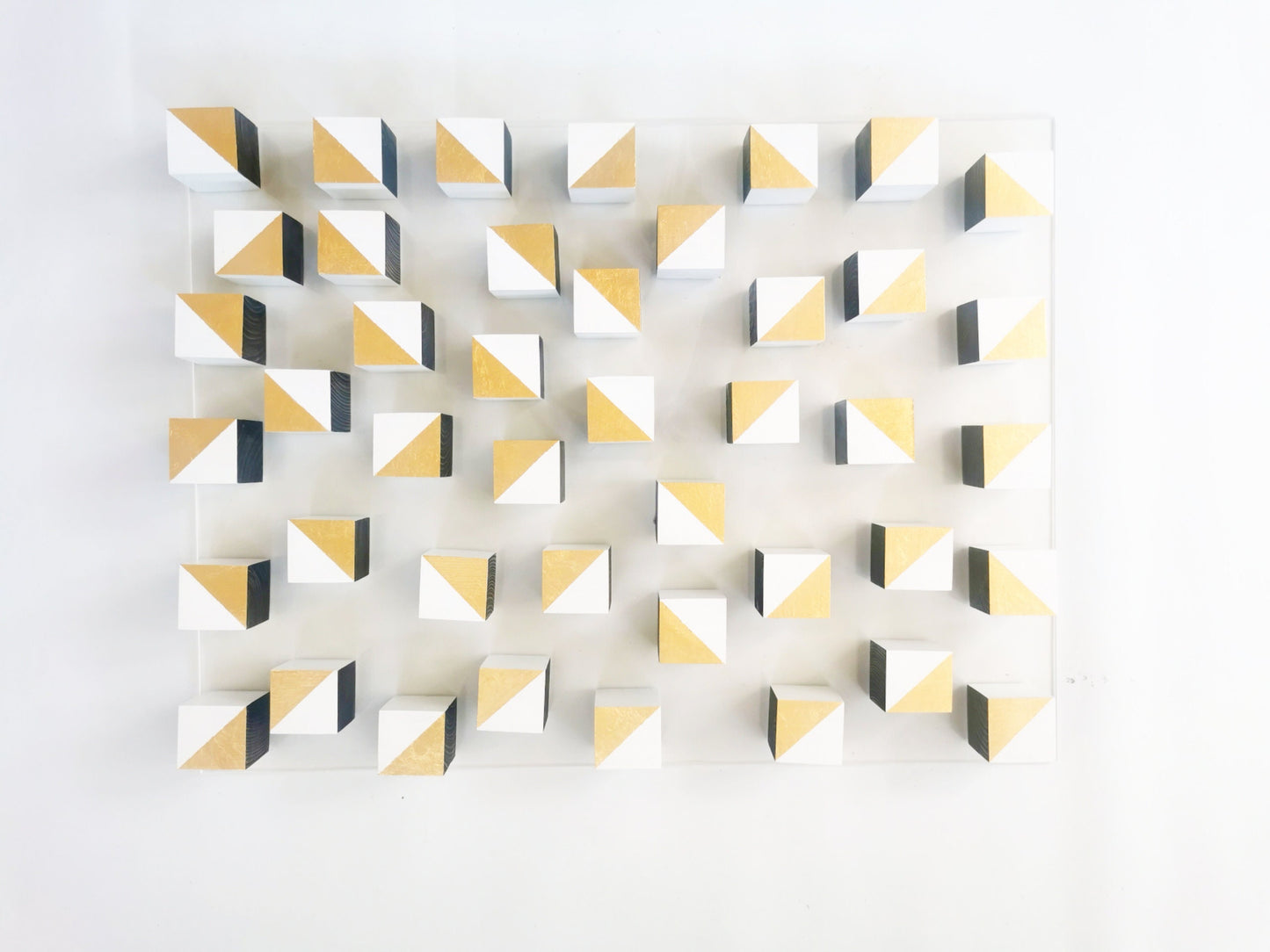 White and gold wood wall art. 3D art. Modern and geometric wall decor. Gold leaf, Home decoration and 3d installation. Sculpture wooden art