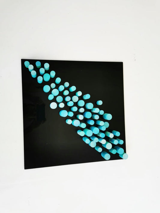 Sculpture wall art, 3D art. Different wood wall art in bold colors. Blue and turquoise dowels . Modern design in black acrylic glass base.©