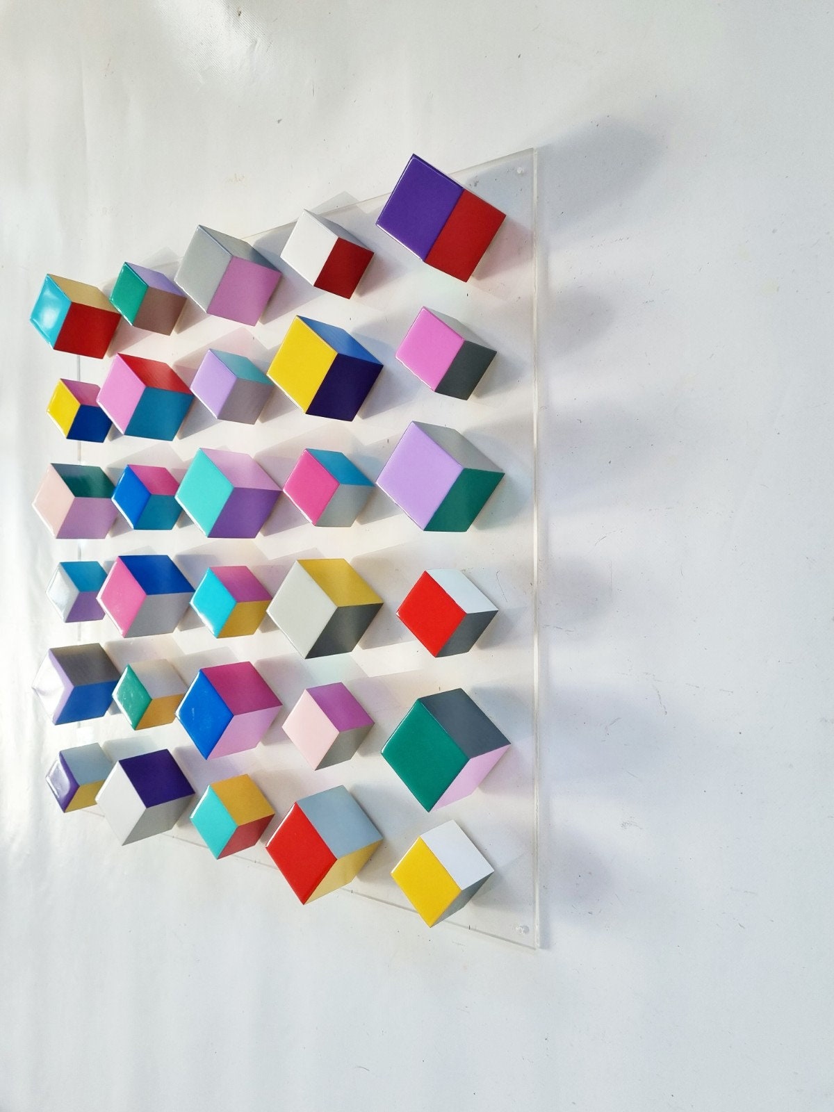 Modern and unique wood wall art. Geometric art. Hand painted with happy colors. Bright Resin finish on top face. Wood Sculpture. Cube art. ©