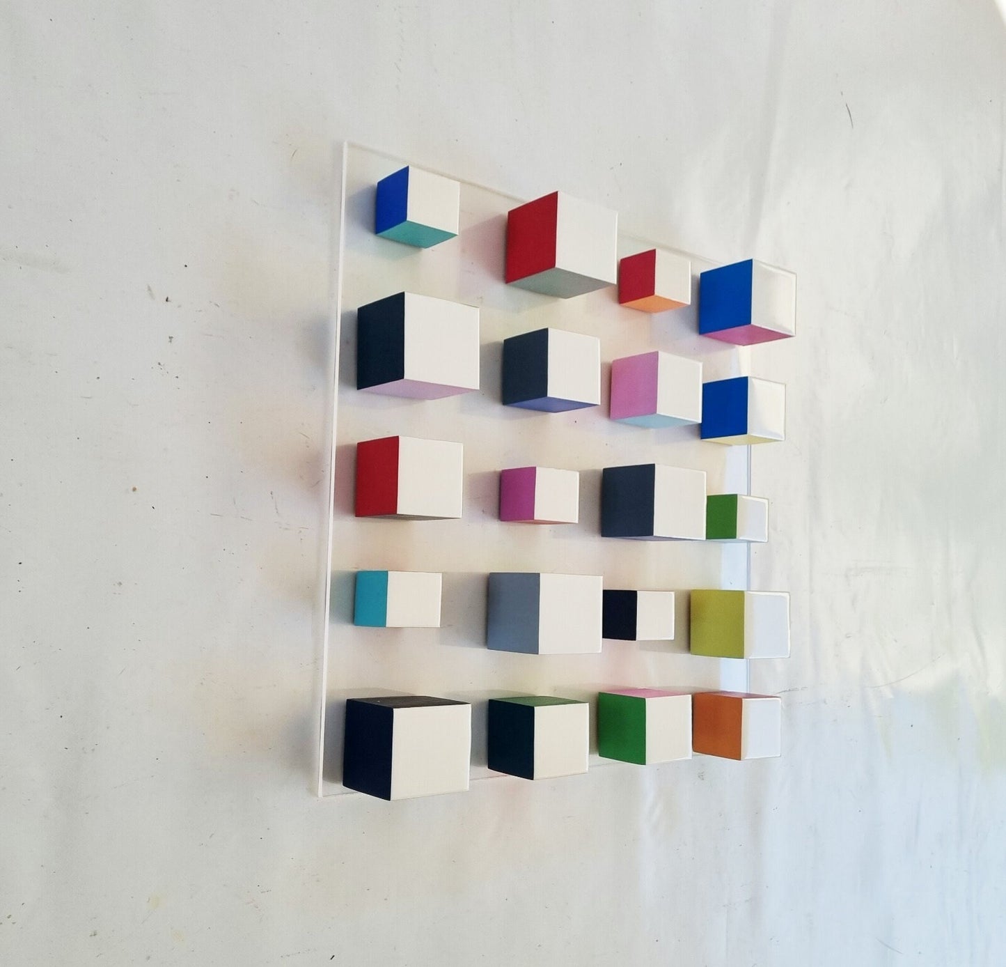 White blocks with resin on top face. Happy colors, 3d wood wall art colorful wooden cubes on acrylic, panel ready to install.