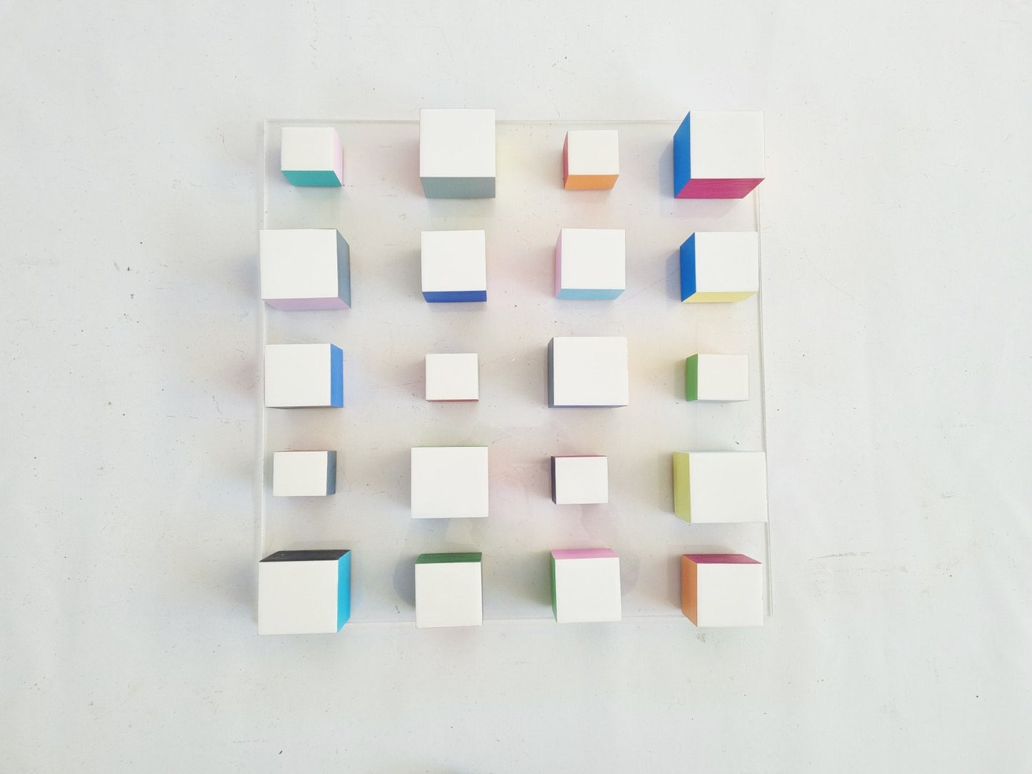 White blocks with resin on top face. Happy colors, 3d wood wall art colorful wooden cubes on acrylic, panel ready to install.