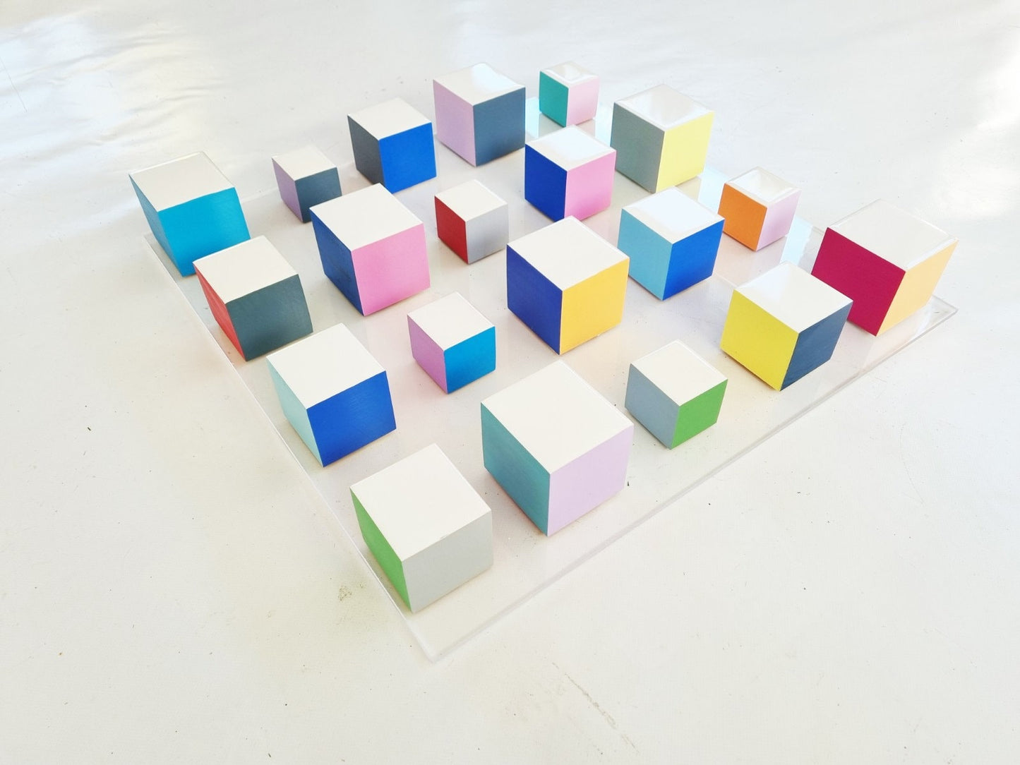 White blocks with resin on top face. Happy colors, 3d wood wall art colorful wooden cubes on acrylic, panel ready to install.