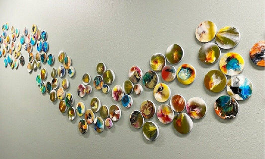 3d installation, hand painted circles with resin on top face. Each circle is a unique work of art. Glossy and shiny ©