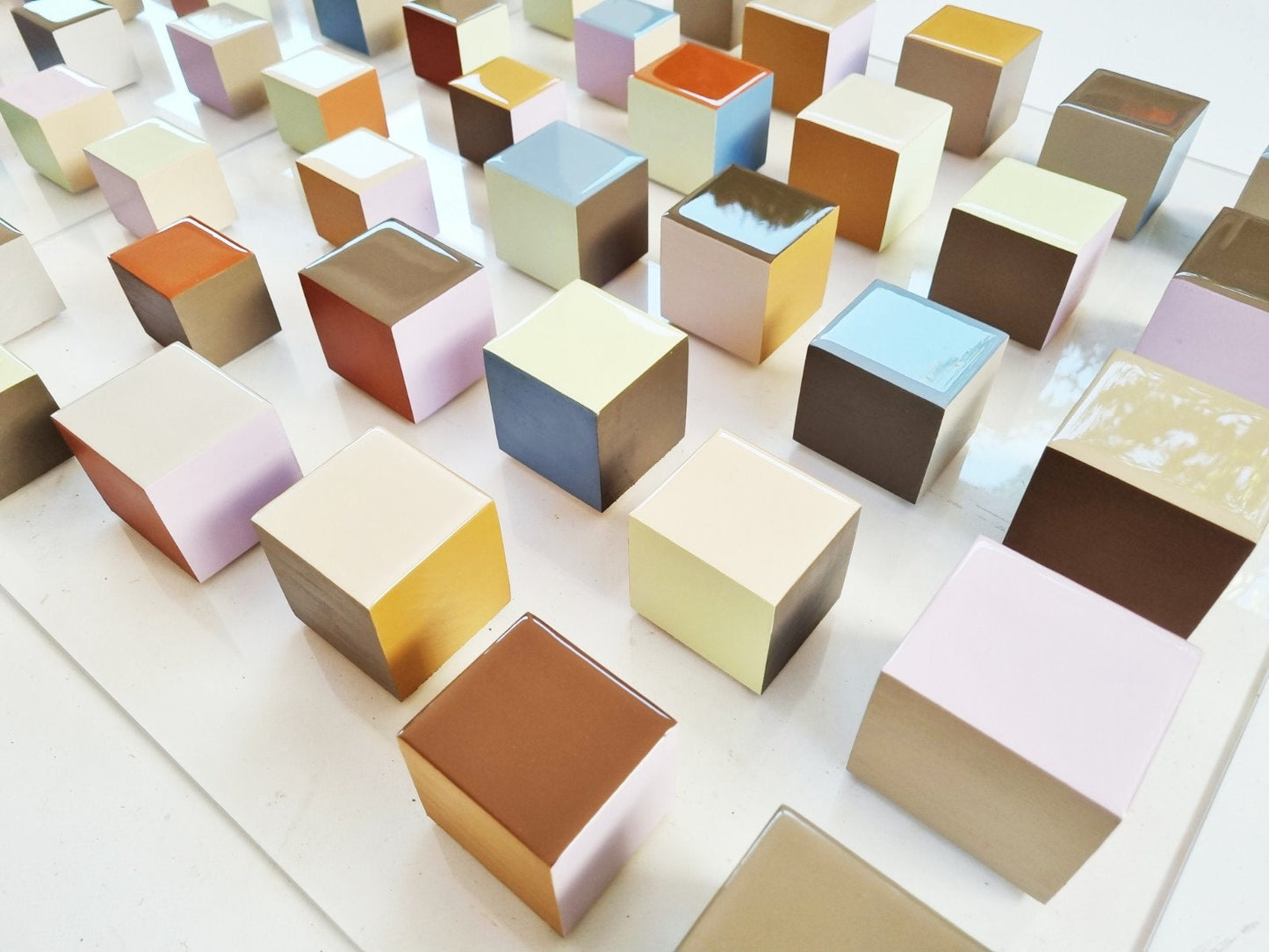 Neutral, natural soft colors, Hand-painted wooden blocks with a glossy epoxy resin finish. Each cube is a small piece of art©