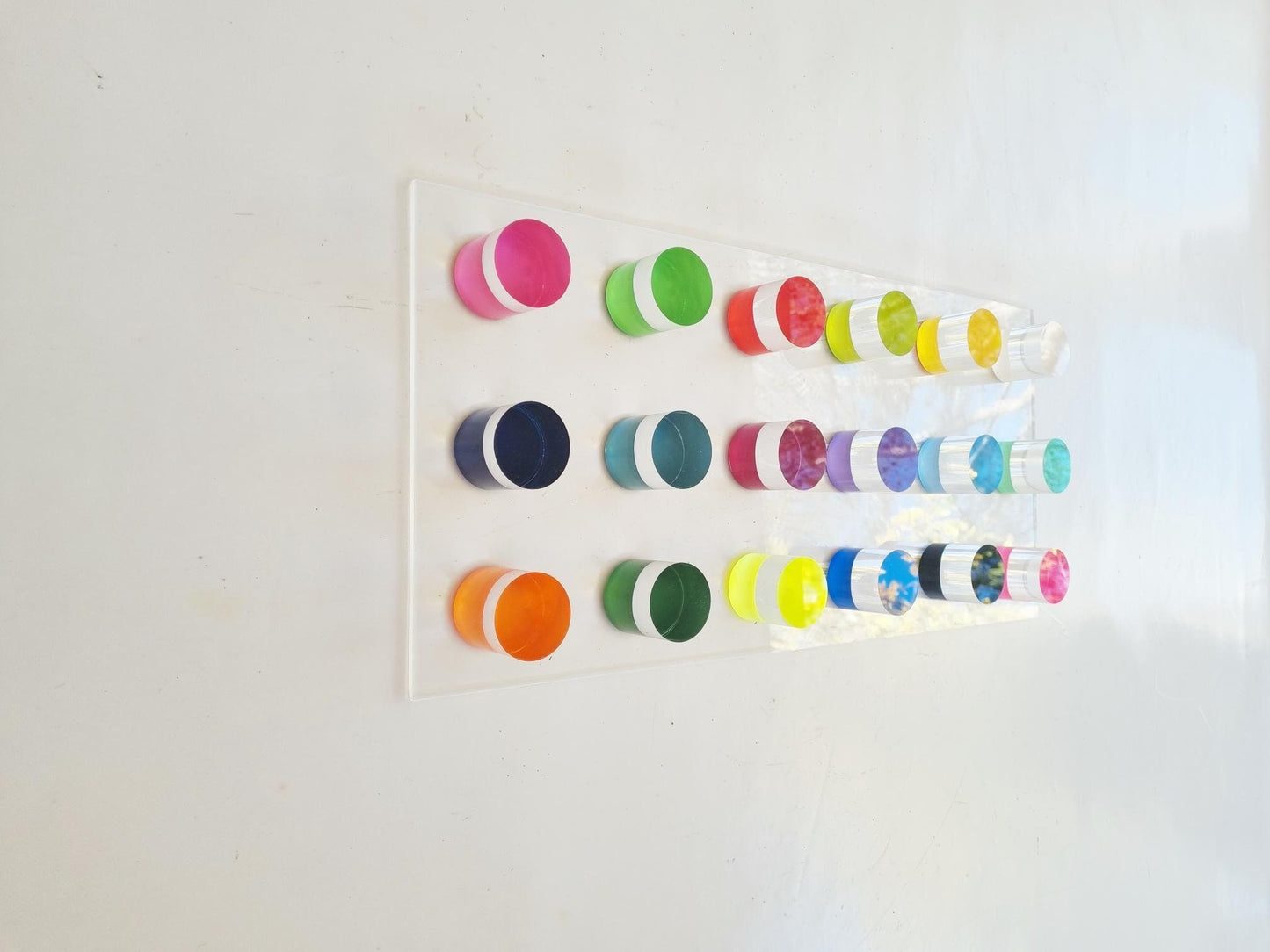 Hand painted colored wall cylinders. Transparent Acrylic circles on Perspex base. 3d modern wall art. Geometric wall art. Happy bold colors.