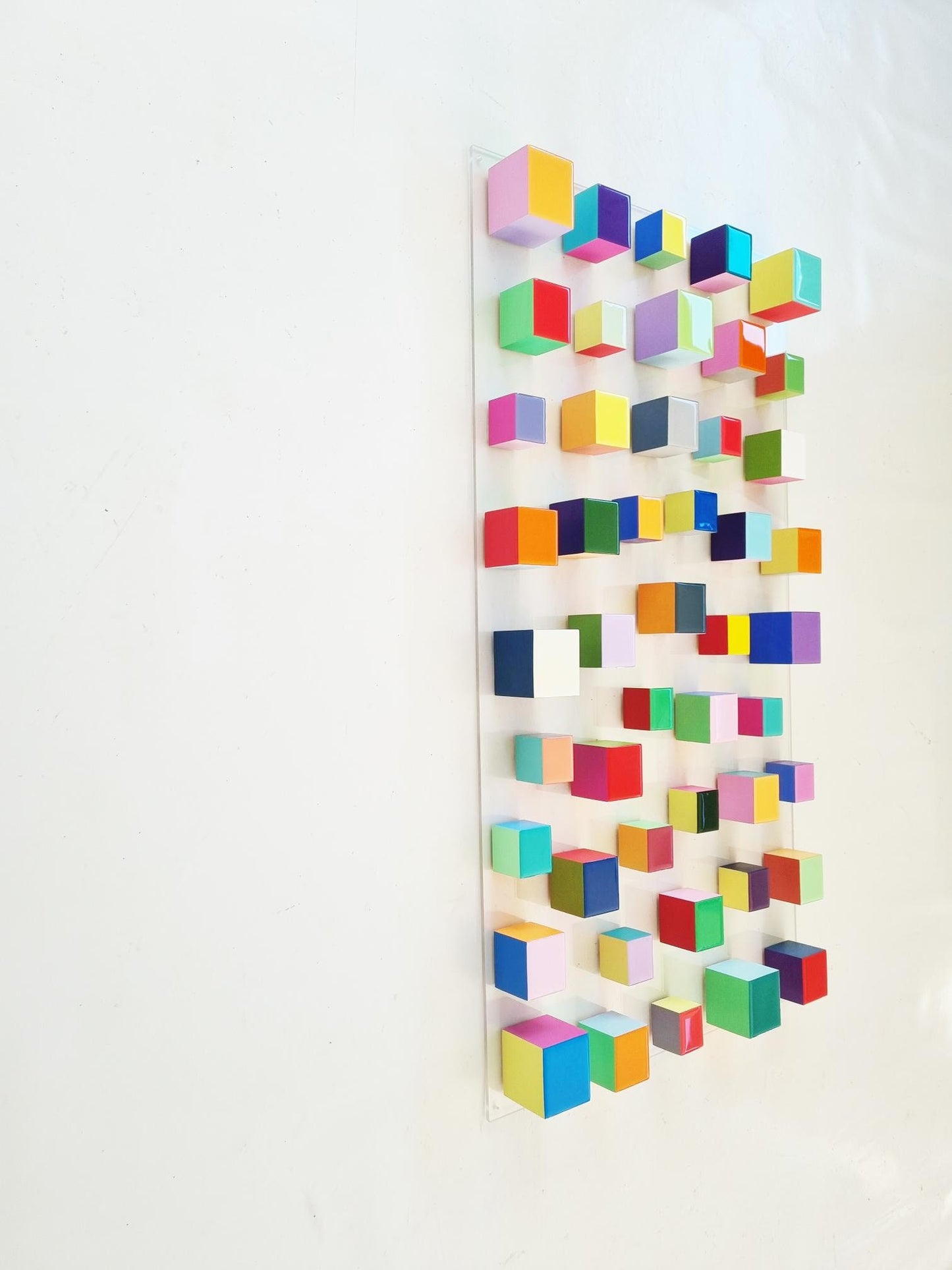 Wood wall art in happy and bold colors. 3d wooden cubes with resin on top face. It can be hung vertically or horizontally. Modern art©